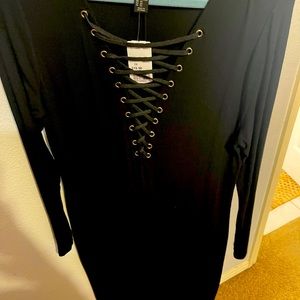 Black, long, forever 21 knitted dress. Lace up, low cut beauty. Never worn!